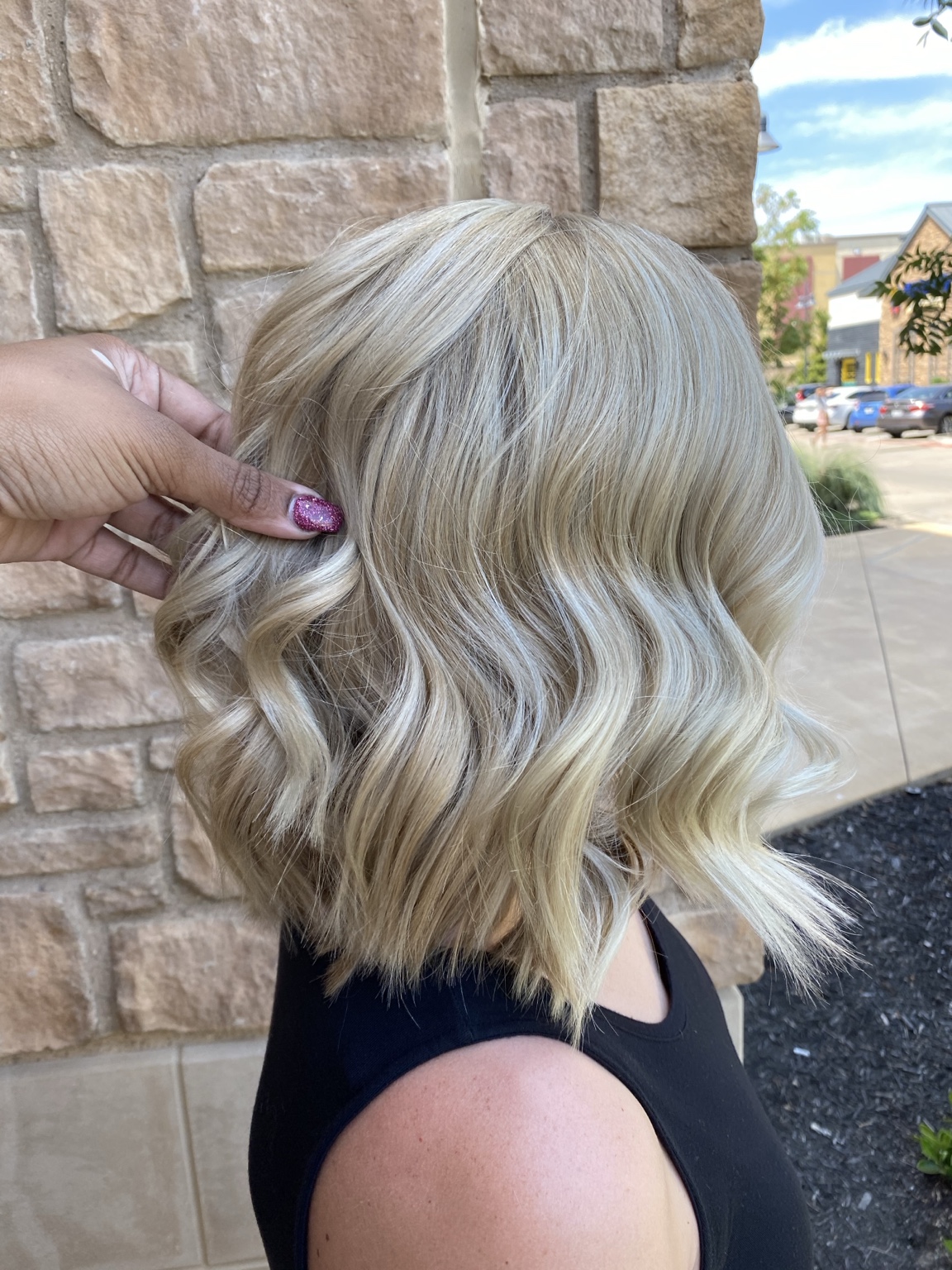 Short platinum dimensional bob styled in soft waves